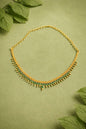 Gold necklace with green gem stones