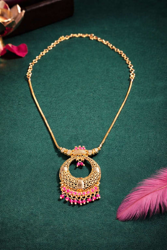 Ornate gold necklace with PINK gemstones