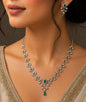 Rhodium plated with emerald american diamond set