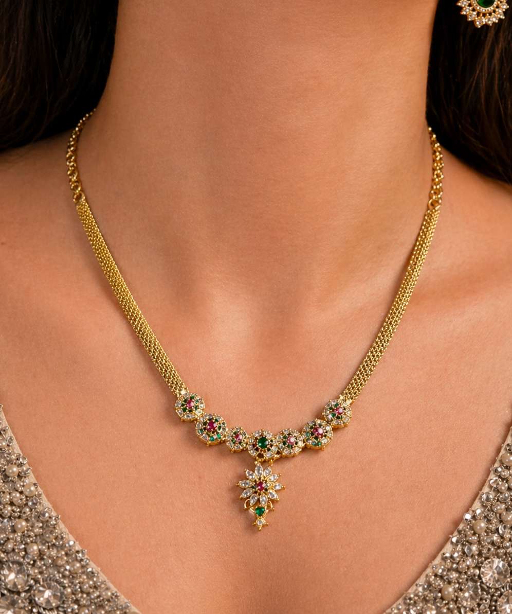 gold and AD with emerald and ruby