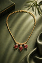 gold necklace with ruby pendant and AD